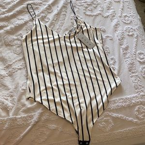 Black and white striped bodysuit. NWT. Size L
